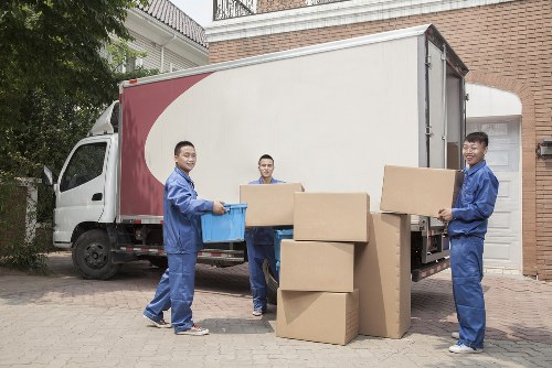 Household items and boxes being transported by a moving truck in Enfield