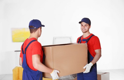 Removal team reviewing a complaint form during a house move