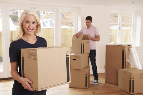 Moving home in Enfield with boxes and furniture being loaded safely