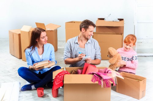 Local removals team handling household items during an Enfield house move