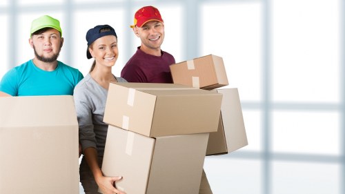 Packed moving boxes and furniture prepared for transport