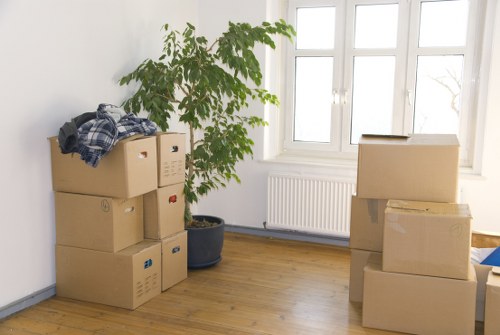 Removal team loading household items with care on moving day