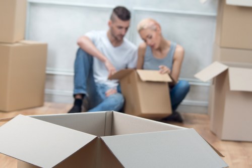 Packing boxes and fragile household items for a move in Enfield