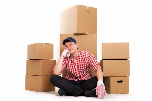 Professional movers loading items for an Enfield relocation